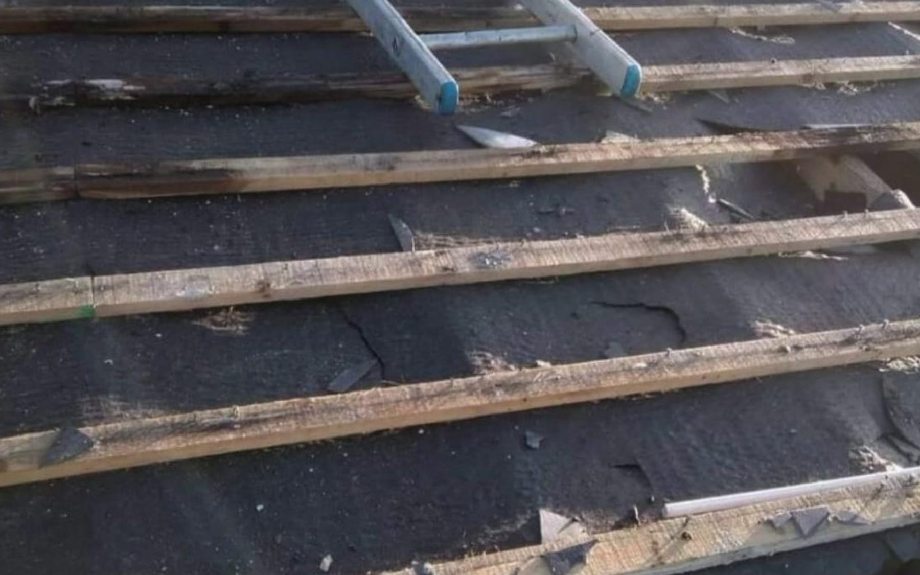 Roof stripped back to the battens before re-covering