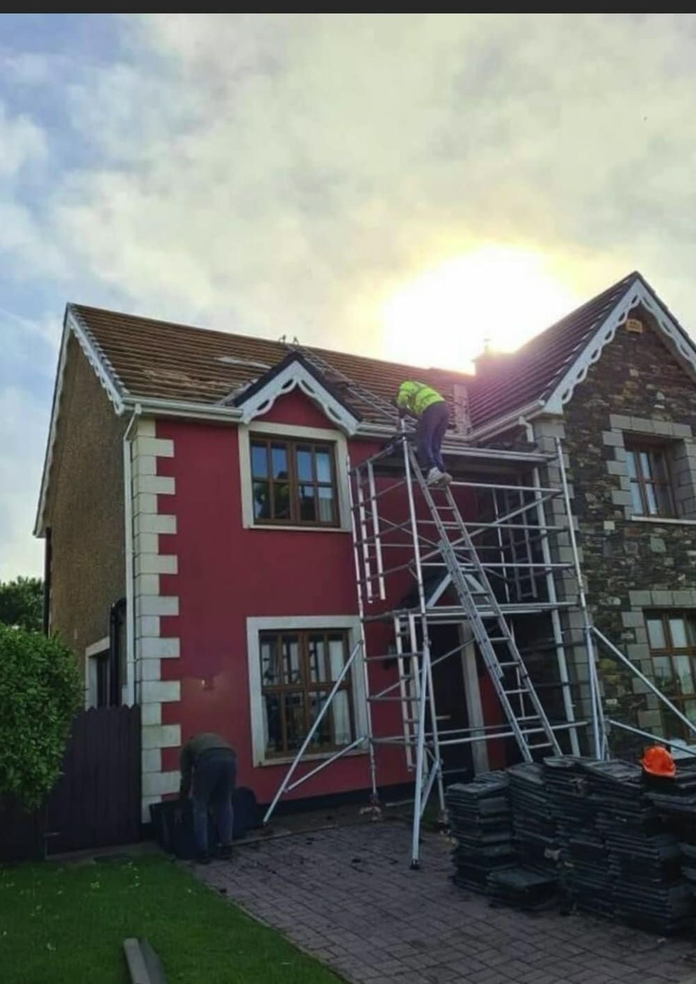 Two-storey re-roof underway with the new tiles on site